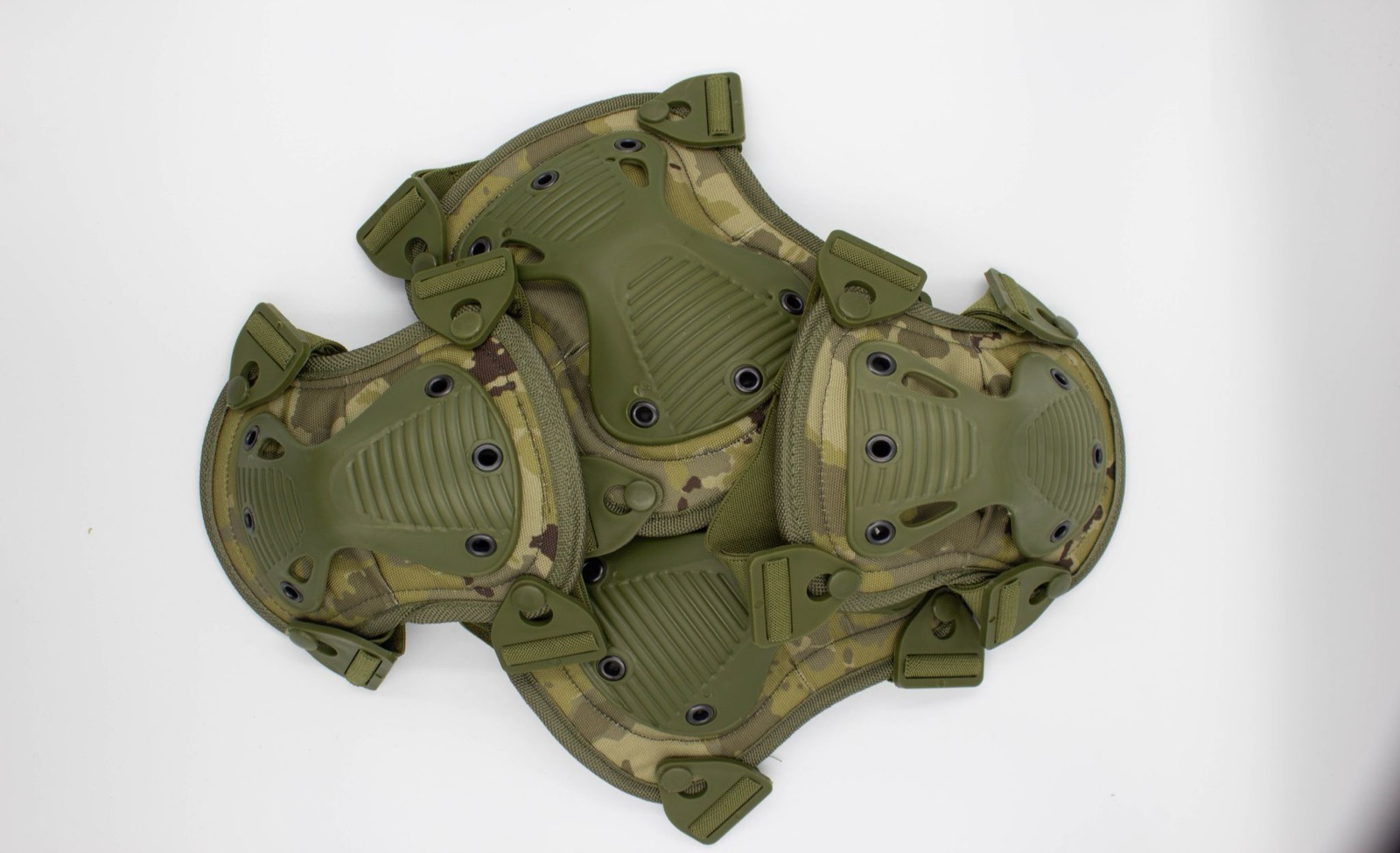 A set of camouflage knee and elbow pads with hard plastic shells